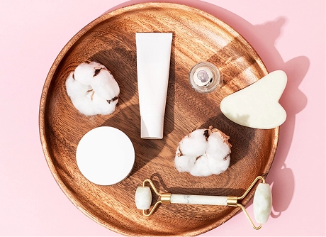 Overhead still life of skincare products on a table