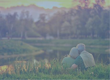 A couple watches a sunset together